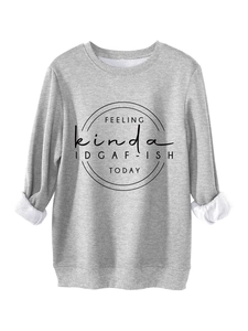 Detail of gray crewneck sweatshirt showing white lining texture and IDGAF-ISH slogan