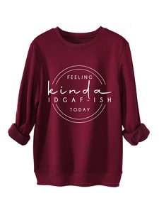 Detail of red crewneck sweatshirt with FEELING kinda IDGAF-ISH TODAY text print