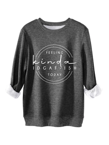 Detail of dark grey crewneck sweatshirt showing white interior fleece and letter print