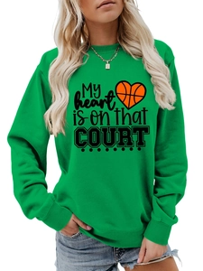 Detail of green cotton sweatshirt showing ribbed cuffs and printed basketball heart logo