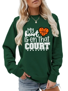 Detail of dark green sweatshirt featuring a My Heart Is On That Court basketball graphic