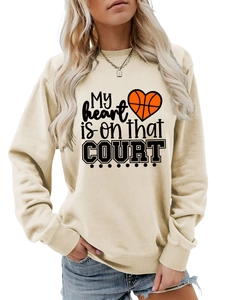 Detail of cream sweatshirt with My heart is on that COURT basketball graphic and ribbed cuffs