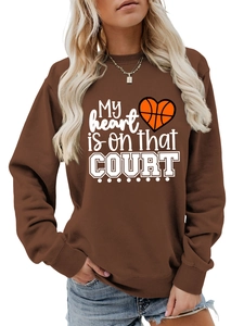 Close-up of My heart is on that COURT basketball print on brown oversize sweatshirt