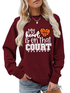 Detail of the high-quality white basketball heart print on a maroon casual sweatshirt