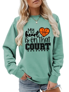 Detail of mint green sweatshirt with My heart is on that COURT basketball print