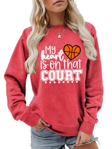 Close-up of red crew neck sweatshirt featuring heart basketball graphic and court text print