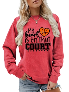 Detail view of the ribbed cuffs and basketball heart print on the red pullover sweatshirt