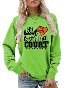 Detail of neon green crewneck sweatshirt showing My Heart Is On That Court basketball print