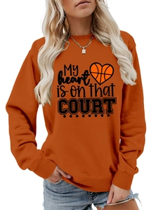 Detail of the orange pullover sweatshirt showing My heart is on that COURT basketball print