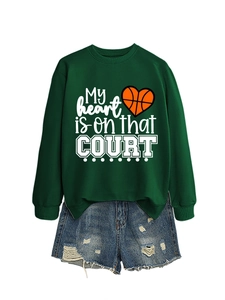 Detail of green sweatshirt with My Heart Is On That Court slogan and heart basketball