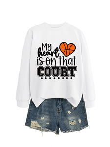 Detail of white long sleeve sweatshirt with heart basketball print and ripped denim shorts