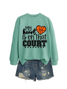Detail of mint green sweatshirt with My heart is on that COURT basketball graphic