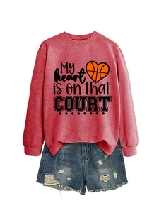 Detail of dark red sweatshirt with basketball heart print and distressed denim shorts