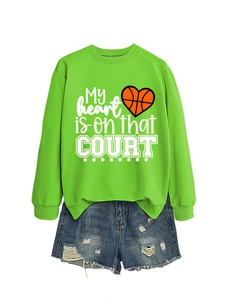 Detail of neon green sweatshirt with basketball heart print and denim shorts combo