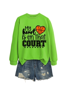 Neon green sweatshirt with basketball heart print paired with distressed denim shorts