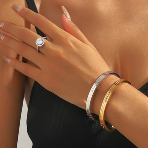 Titanium steel multi-layer ribbed bracelets and round zircon ring in 18K gold and silver