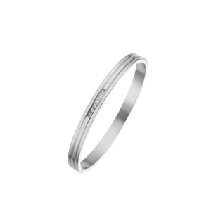 Macro detail of silver stainless steel bangle with parallel grooves and zircon inlay