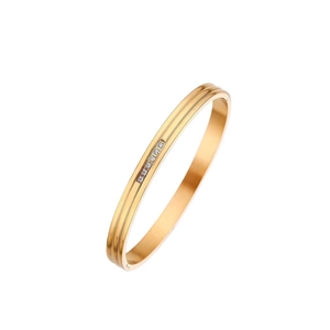 18K gold plated titanium steel ribbed bangle with six inlaid round white zircons