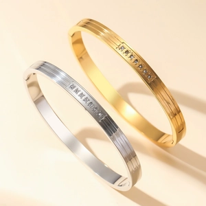 Titanium steel ribbed bangles with 18K gold plating and inlaid round white zircons