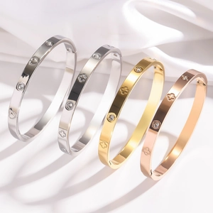 Bracelets charnière en acier inoxydable poli avec motifs trèfle, cœur et cristaux