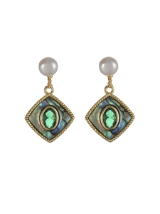 Detail of vintage Baroque earrings with freshwater pearls and green gemstones