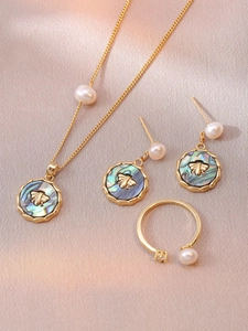 Detailed set of bee pendant necklace, pearl earrings and adjustable open ring on silk