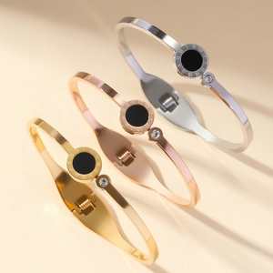 Three-piece stainless steel bangle set with Roman numerals and black inlay detailing