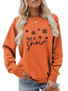Detail of Let It Snow lettering and snowflake prints on orange crewneck sweatshirt
