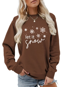 Close-up of let it snow white typography and snowflake pattern on dark brown sweatshirt