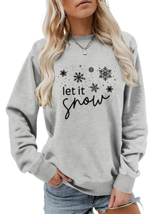 Detail of grey crewneck sweatshirt featuring black let it snow text and snowflake design