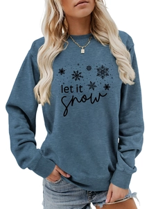 Detail of the blue Let it Snow sweatshirt showing the snowflake print and ribbed cuffs