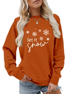 Detail of orange crewneck sweatshirt featuring white let it snow and snowflake print