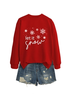 Detail view of red 'Let It Snow' holiday sweatshirt paired with distressed denim shorts