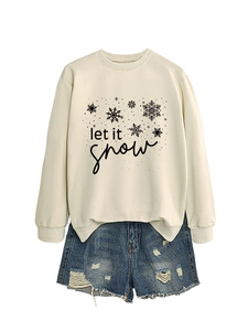 Detail of Let It Snow sweatshirt featuring snowflakes and high-quality cotton texture