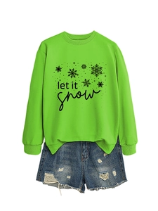 Detailed view of neon green 'Let It Snow' crewneck sweatshirt with snowflake prints