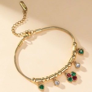 Bracelet en acier doré avec breloques cœurs et trèfle en zircon sur chaîne serpent