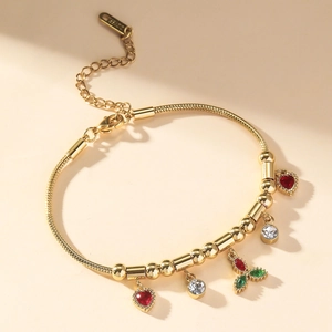 Elegant gold snake chain bracelet with heart-shaped zircon charms and adjustable lobster clasp