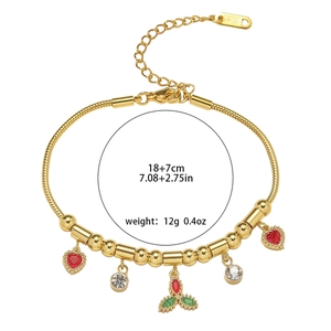 Golden titanium steel bracelet with colorful zircon heart and leaf charms on white background