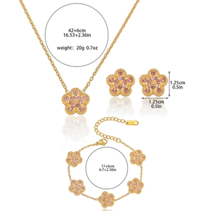 Pink clover jewelry set with gold necklace, bracelet and earrings featuring crystal stones