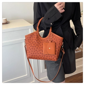 Close-up of vintage pattern tote bag with matching small coin purse and strap