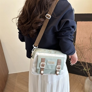 Casual crossbody bag in mint green and ivory white with fashion logo patch for girls