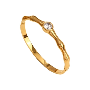 Elegant gold bamboo style open bracelet featuring a central sparkling zircon stone