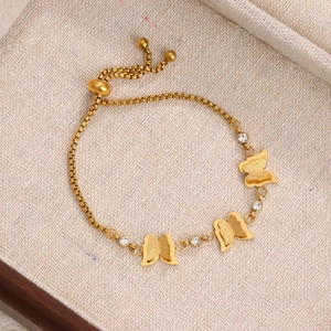 Golden butterfly bracelet with box chain, zircon accents and adjustable sliding buckle