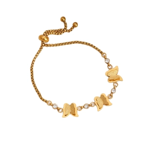 Adjustable gold butterfly chain bracelet with sparkling rhinestones on white background