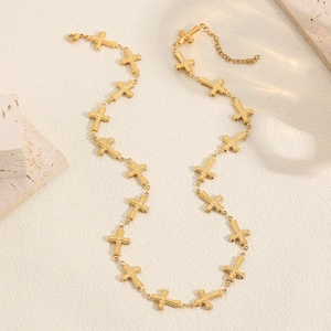 Gold-plated stainless steel necklace featuring connected cross links on a neutral background