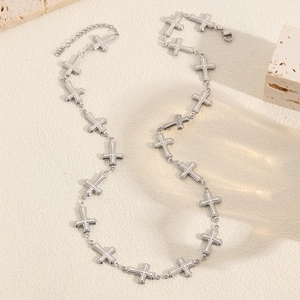 Detail of beaded cross pendant necklace with adjustable chain and lobster clasp