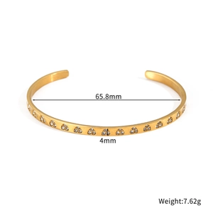 Polished gold stainless steel geometric cuff bracelet with cubic zirconia inlays