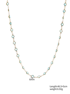 Detail showing 6mm blue glass gems in gold bezel setting with 46.5+5cm chain specs