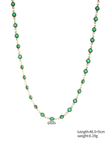 Detail showing 6mm green bezel-set glass crystals on a 46.5cm gold-tone necklace chain