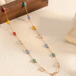 Ethnic gold chain necklace featuring faceted colorful crystal beads in a vintage style
